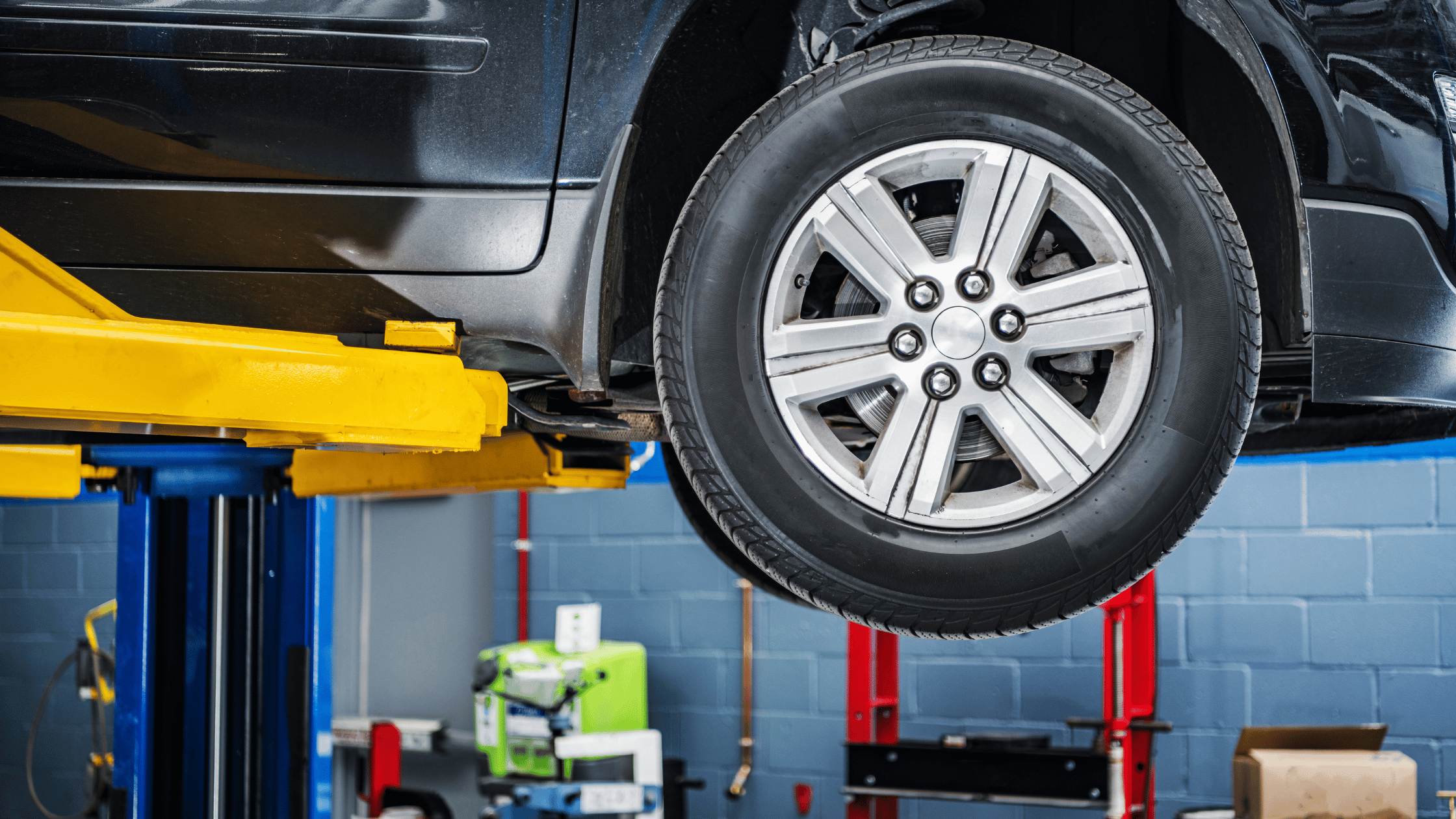 car up on a lift for non-conformity