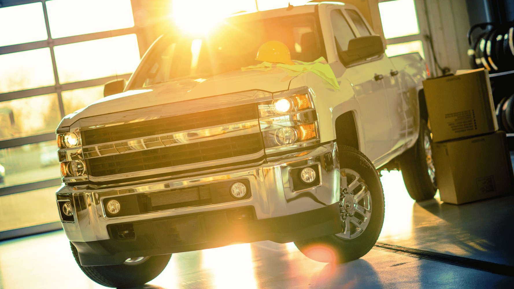 white truck in a car dealership showroom which is covered under California truck lemon law